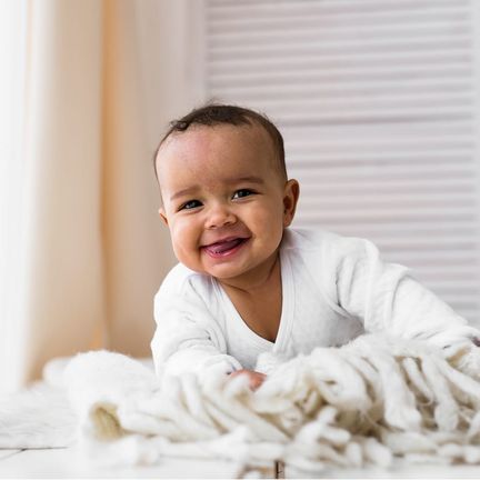 A smiling baby at home