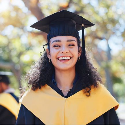 A woman graduate in cap and gown