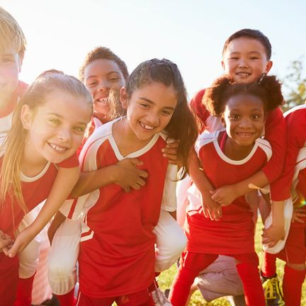 A youth sports team smiling